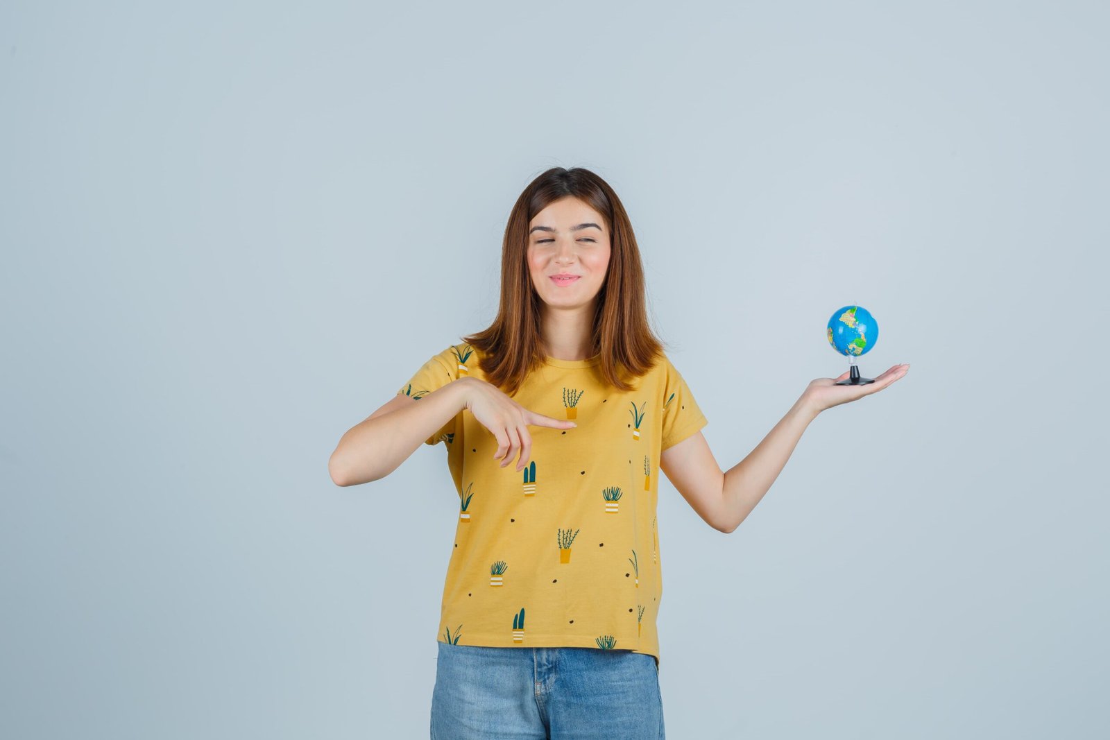 Hands holding a small green sapling